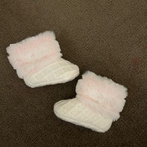 White and pink fur boots.